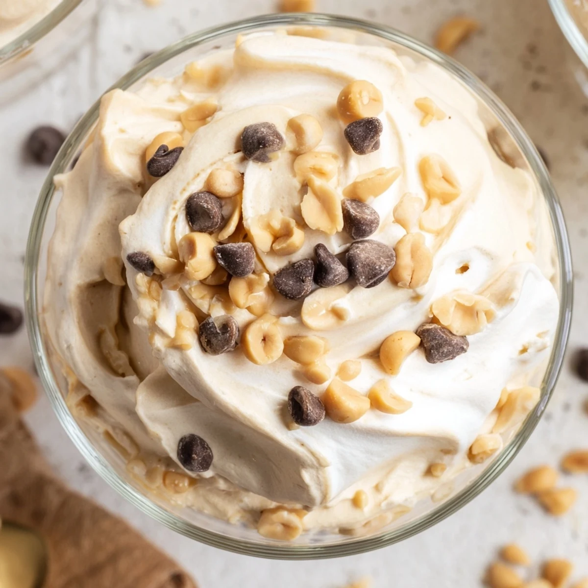 Fluffy peanut butter and Cool Whip mousse dessert with vanilla and powdered sugar