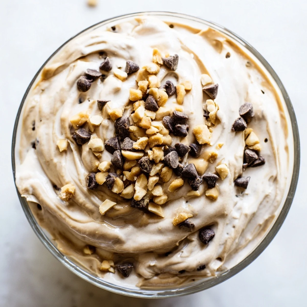 Light American peanut butter mousse with whipped topping and garnished peanuts for easy dessert