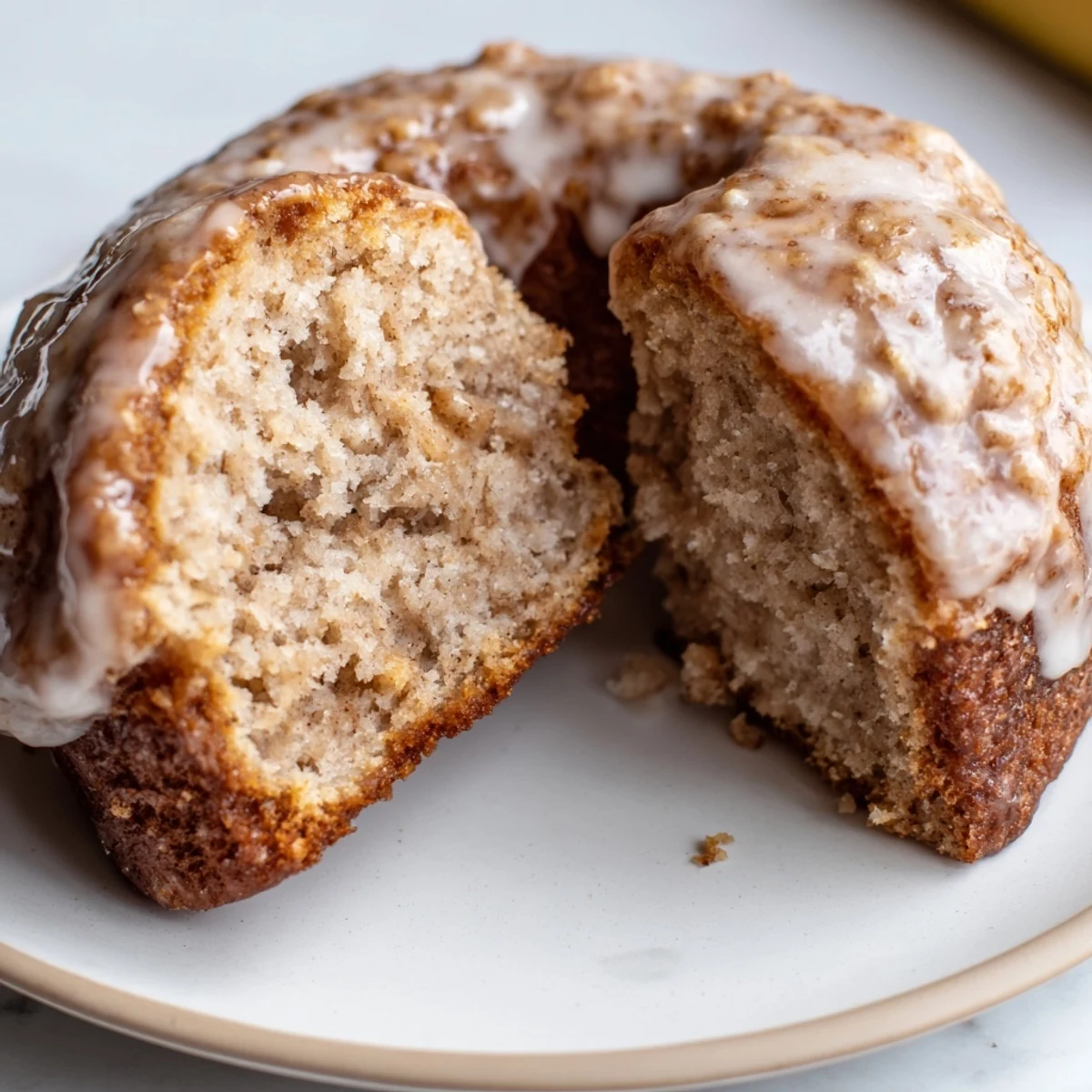 Banana Donuts cooling on a wire rack, golden, tender, sweet fruity aroma