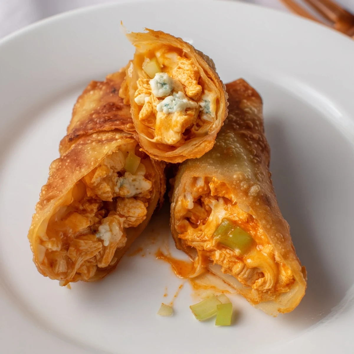 Buffalo Chicken Egg Rolls Recipe: golden, crispy rolls with spicy cheesy filling