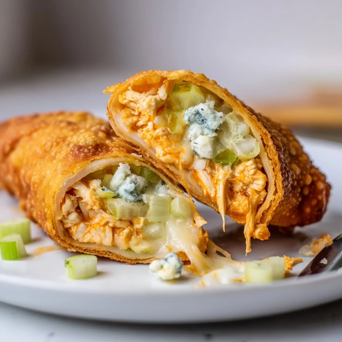 Crisp Buffalo Chicken Egg Rolls Recipe served warm with creamy blue cheese