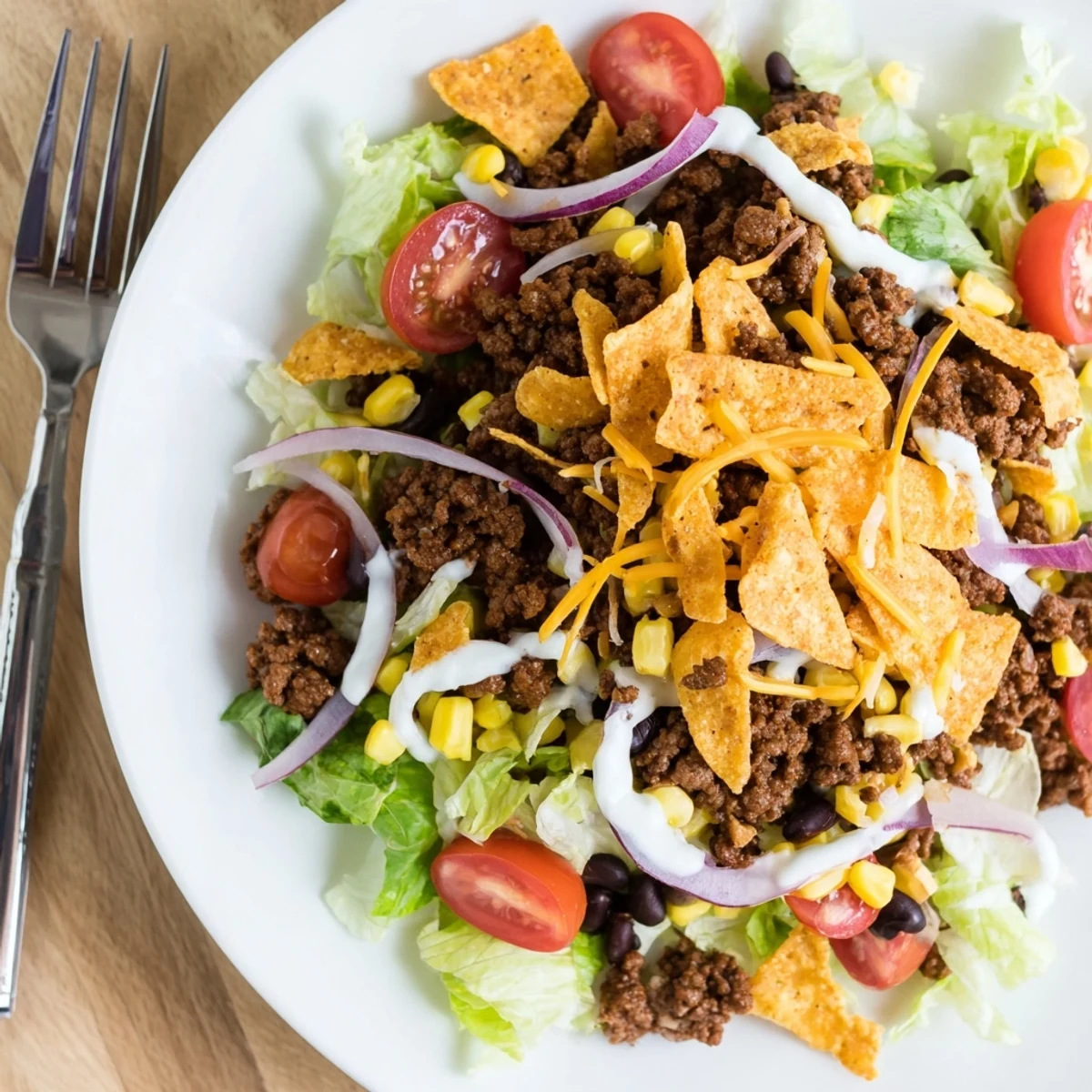 Simple Doritos Taco Salad ready in 25 minutes, tangy dressing, zesty crunch