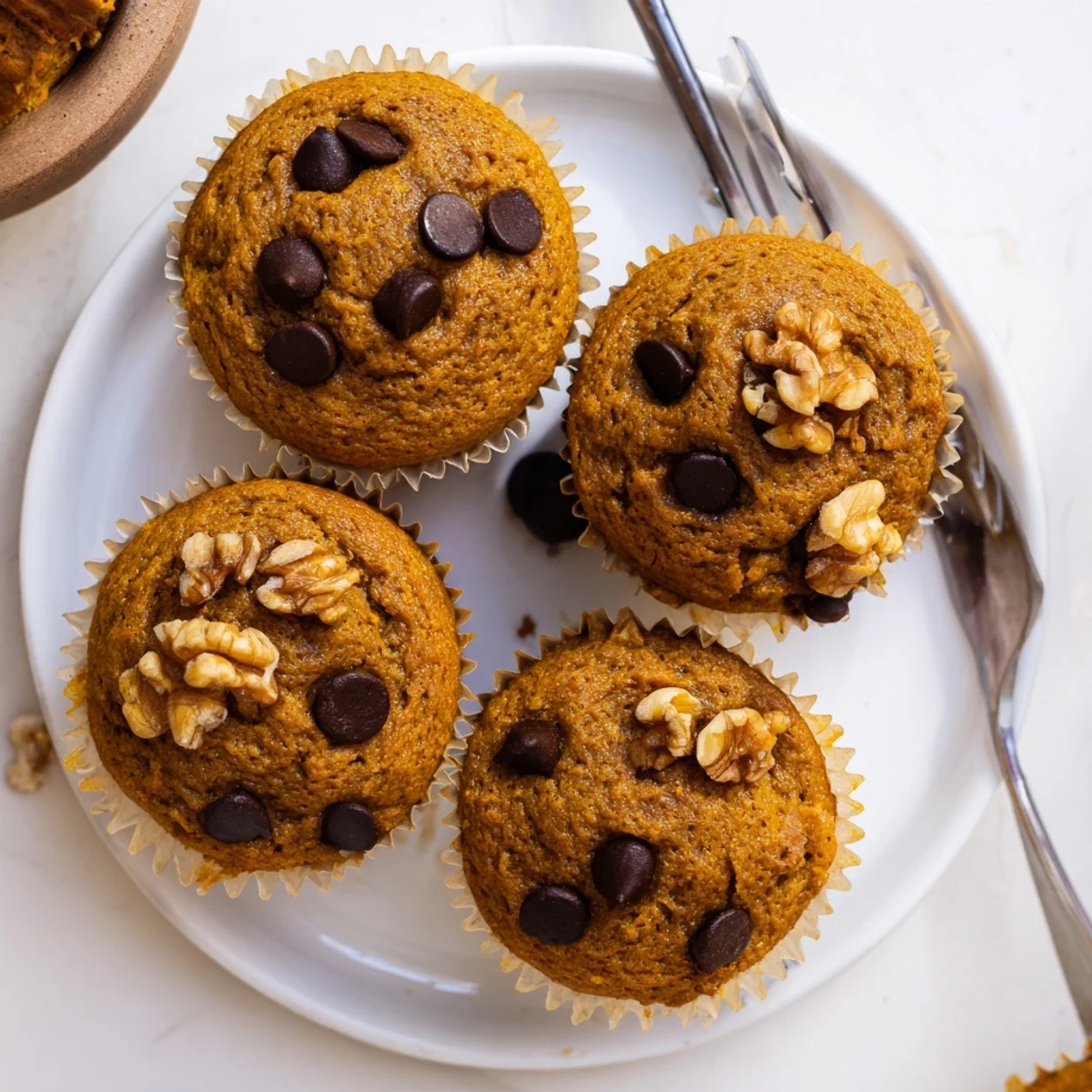 Batch of twelve naturally sweet butternut squash banana muffins fresh from the oven