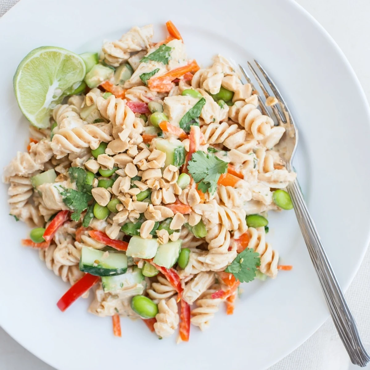Colorful protein packed Thai pasta salad tossed in creamy peanut dressing with fresh vegetables